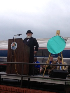 A man dressed as Collis P. Huntington greets the crowd.